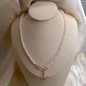 Vivienne Westwood pearl necklace. Freshwater pearl compared to akoya quality
